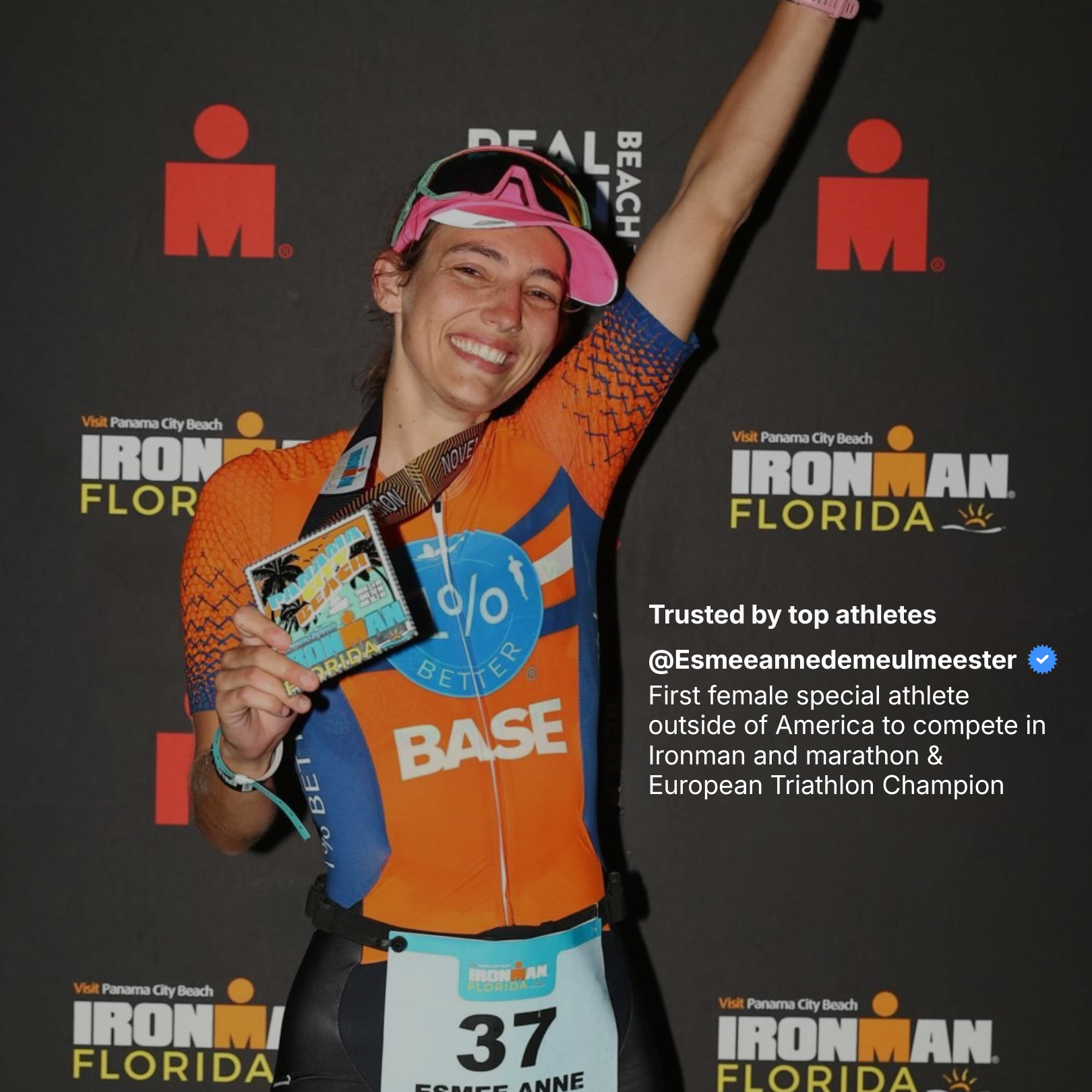 Athlete celebrating with a medal at Ironman Florida event
