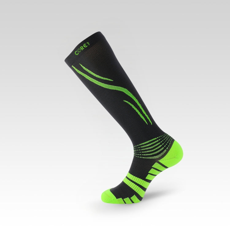 Black and green sock on a light gray background
